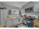 Efficient kitchen featuring stainless steel appliances, bright white cabinets, and ample counter space at 3106 E Diana St, Tampa, FL 33610