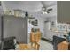 Functional kitchen with white cabinets, a table with chairs, and modern appliances, maximizing space and utility at 3106 E Diana St, Tampa, FL 33610