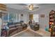 Inviting living room features neutral walls, tile flooring, and cozy furniture, creating a comfortable ambiance at 3106 E Diana St, Tampa, FL 33610
