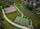 Aerial view of the tennis and basketball courts alongside the community walking and biking path at 3150 San Jose St, Clearwater, FL 33759