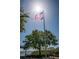 Image of an American Flag waving on a flagpole at 3150 San Jose St, Clearwater, FL 33759