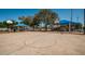 Outdoor basketball court with blue shade structures and playground equipment at 3150 San Jose St, Clearwater, FL 33759