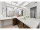 Well-lit bathroom with large countertop vanity and tiled floors at 3150 San Jose St, Clearwater, FL 33759