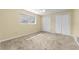 Bedroom with carpet flooring and closet doors at 3150 San Jose St, Clearwater, FL 33759