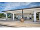 Exterior image of community bathrooms with multiple stalls, gray and white paint job, and drinking fountain at 3150 San Jose St, Clearwater, FL 33759