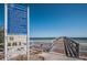 Image of a community pier with visible rules, regulations, and rescue tips at 3150 San Jose St, Clearwater, FL 33759