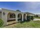 Close up of single-story home's arched entryway and well-maintained landscaping at 3150 San Jose St, Clearwater, FL 33759