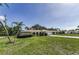 Inviting single-story home with arched entryway, lush lawn, and mature landscaping at 3150 San Jose St, Clearwater, FL 33759