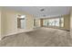 Bright living room with large windows and neutral carpet, offering ample natural light at 3150 San Jose St, Clearwater, FL 33759