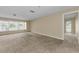 Spacious living room featuring a large window showcasing the exterior landscape at 3150 San Jose St, Clearwater, FL 33759