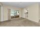 Living room with view of kitchen, sliding doors to pool at 3150 San Jose St, Clearwater, FL 33759