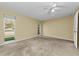 The main bedroom gets ample natural light and a neutral color scheme at 3150 San Jose St, Clearwater, FL 33759