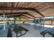 Park pavilion with picnic tables and playground equipment in the background at 3150 San Jose St, Clearwater, FL 33759