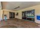 Covered patio with sliding glass doors leading to the screened-in pool area at 3150 San Jose St, Clearwater, FL 33759