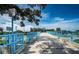 Inviting pedestrian bridge with sturdy blue railings and a scenic view to McMullen Booth Rd on a clear and sunny day at 3150 San Jose St, Clearwater, FL 33759
