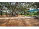 Community playground featuring picnic tables and mature trees, providing a shady spot for relaxing outdoors at 3150 San Jose St, Clearwater, FL 33759