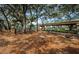 This community playground provides a fenced-in area for outdoor activity with mature trees to stay cool at 3150 San Jose St, Clearwater, FL 33759