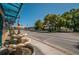 Street view with storefronts, water fountain, and palm trees at 3150 San Jose St, Clearwater, FL 33759