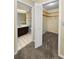 Walk-in closet connected to the main bathroom featuring a neutral color scheme at 3150 San Jose St, Clearwater, FL 33759