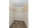 Walk-in closet featuring wire shelving and neutral carpeting at 3150 San Jose St, Clearwater, FL 33759