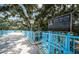 Elevated pedestrian bridge over Ream Wilson Recreation Trail, surrounded by mature trees and landscaping at 3150 San Jose St, Clearwater, FL 33759
