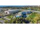 Stunning aerial view showcasing the waterfront community, featuring a pool, lush landscaping, and nearby waterways at 3315 58Th S Ave # 421, St Petersburg, FL 33712