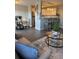 Living room extending to dining and kitchen area with stainless steel appliances and bar stool seating at 3315 58Th S Ave # 421, St Petersburg, FL 33712