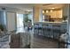 Inviting living room and kitchen area with bar seating and sliding glass doors to the balcony at 3315 58Th S Ave # 421, St Petersburg, FL 33712