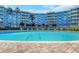 Inviting pool with brick border with lounge chairs nearby at the condo complex at 3315 58Th S Ave # 421, St Petersburg, FL 33712