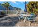 Charming patio area next to the pool with a table, chairs, and an umbrella for comfortable outdoor relaxation at 3315 58Th S Ave # 421, St Petersburg, FL 33712