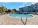 Inviting swimming pool area surrounded by lounge chairs and mature landscaping, perfect for relaxation at 3315 58Th S Ave # 421, St Petersburg, FL 33712