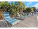 Inviting pool deck with comfortable lounge chairs, providing a tranquil space for relaxation amidst lush greenery at 3315 58Th S Ave # 421, St Petersburg, FL 33712