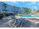 Relaxing poolside scene with lounge chairs, showcasing the condo's outdoor amenities at 3315 58Th S Ave # 421, St Petersburg, FL 33712