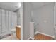 Bathroom with a shower-tub combo, neutral tile flooring and a wood vanity with a gray wall at 3455 Castle Stone Ct, Valrico, FL 33594
