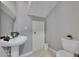 Bathroom with pedestal sink, tiled floor, and modern fixtures at 3455 Castle Stone Ct, Valrico, FL 33594