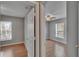 Bedroom view from the doorway, featuring wood-look floors and natural light from the window at 3455 Castle Stone Ct, Valrico, FL 33594