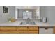 View of the kitchen sink and breakfast bar that opens to the living area at 3455 Castle Stone Ct, Valrico, FL 33594