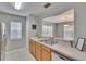 Bright kitchen showcases a breakfast bar, double sink, and neutral countertops at 3455 Castle Stone Ct, Valrico, FL 33594