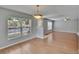 Open-concept living room featuring wood floors and natural light at 3455 Castle Stone Ct, Valrico, FL 33594