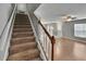 Carpeted staircase with views to the living room area at 3455 Castle Stone Ct, Valrico, FL 33594