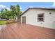 An outdoor deck overlooking the backyard, perfect for entertaining and enjoying the view at 37732 Cecil Ln, Zephyrhills, FL 33542
