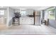 Kitchen with stainless steel appliances, white cabinets, and tiled floor at 37732 Cecil Ln, Zephyrhills, FL 33542