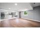 Open floor plan view, showcasing the kitchen with modern stainless steel appliances and wooden floors at 37732 Cecil Ln, Zephyrhills, FL 33542