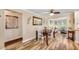 Cozy dining area featuring wood floors, modern decor, and an abundance of natural light at 4076 Mainlands N Blvd, Pinellas Park, FL 33782