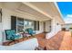Inviting covered front porch with comfortable seating area showcasing the lovely facade at 4076 Mainlands N Blvd, Pinellas Park, FL 33782