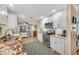 Bright and modern kitchen featuring white cabinets, stainless steel appliances, and an open layout design at 4076 Mainlands N Blvd, Pinellas Park, FL 33782