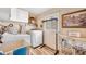 Functional laundry room with modern washer, dryer, and ample storage space at 4076 Mainlands N Blvd, Pinellas Park, FL 33782