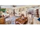 Bright living room with modern furnishings and open layout to the dining area at 4076 Mainlands N Blvd, Pinellas Park, FL 33782