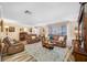 Bright and airy living room with plush furniture, stylish rug, and lots of natural light at 4076 Mainlands N Blvd, Pinellas Park, FL 33782