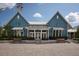 Exterior of community center with brick pathway and manicured landscaping at 4146 Bexley Village Dr, Land O Lakes, FL 34638